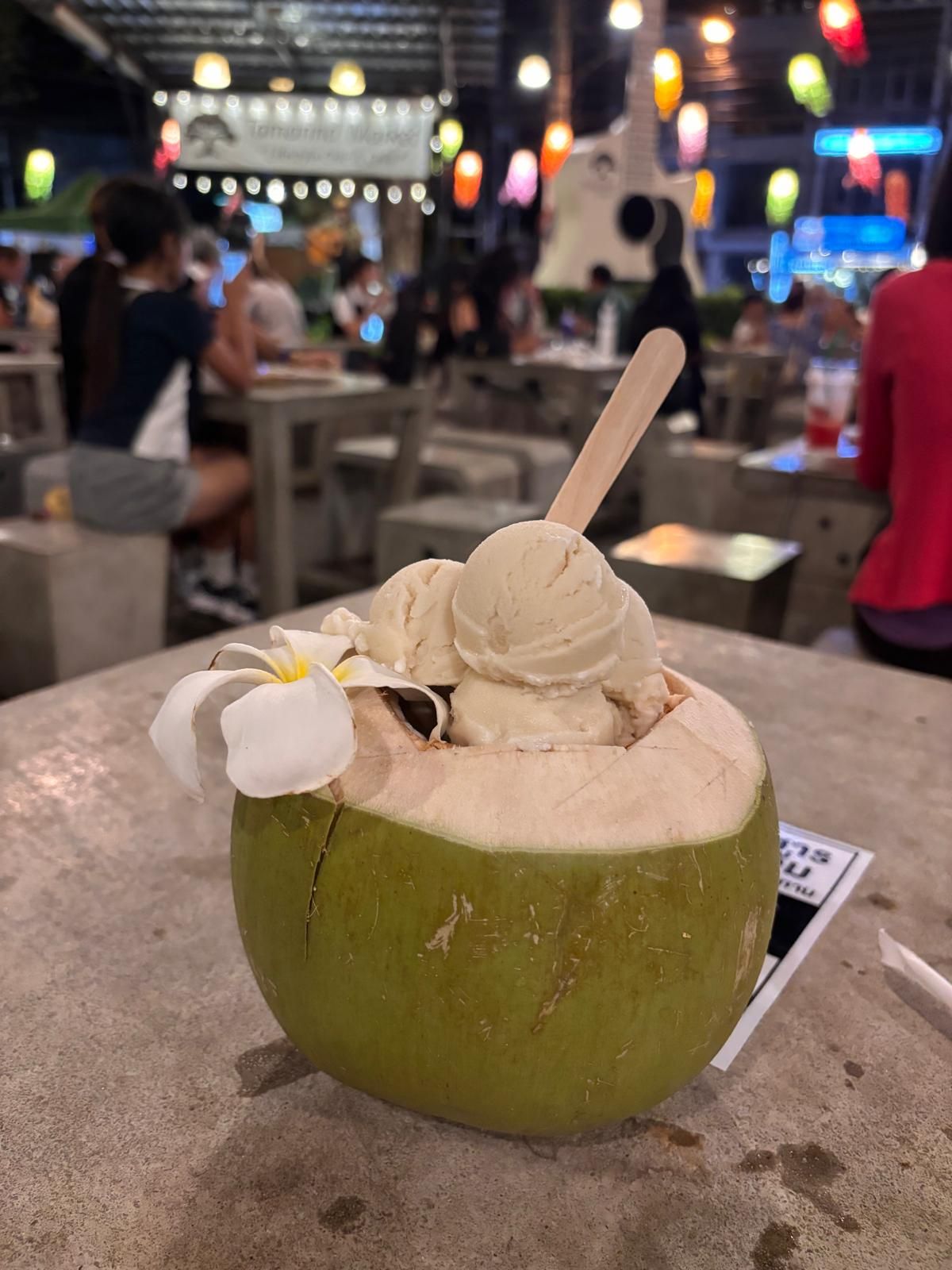 Coconut ice cream served in a fresh coconut at a Hua Hin night market.